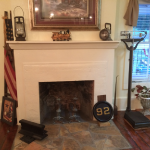 The original fireplace was exposed during restoration after having been cemented over sometime in the past.  The stone work in the fireplace is original but the stone work in front is new.