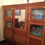 The brass placard on the freezer identifies it as a "Frigidaire, Product of General Motors" sold by the Warren Company of Atlanta, Georgia.  The date 1-13-28 is stamped into the wood along with the serial number.  It was restored by Claude and Faye Hatchett.