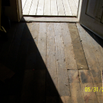 Front entrance before restoration.  Some of these boards were worn down to about 1/4" thick from over 150 years of foot traffic.